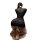 Woman kneeling in black lace bodycon corset dress with push-up effect, showcasing sensual style lingerie set from behind.