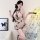 Woman modeling sheer butterfly-embroidered cheongsam sleepwear, holding fan; vintage pure-temptation lingerie set for women.