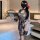 Sensual chinese-inspired sheer high-slit modern qipao set featuring floral lace details and ink wash design, perfect for eleg...
