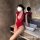 Woman in red lace bodysuit with open-crotch design, posing by a sink. sensual lace bodysuit set - sexy open-crotch mesh sleep...
