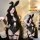 Woman wearing black lace bodysuit with bunny ears, sheer panels, and garter straps. sensual lace bodysuit sleepwear - -ins...