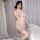 Woman modeling a sheer lace bodysuit with cut-outs and modest bikini-style coverage, featuring delicate mesh detailing and el...