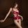 Woman modeling red lace bodysuit with open-crotch design, featuring busty-looking silhouette and modest yet provocative style...