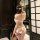 Sensual lace bodysuit featuring open-crotch design, sheer mesh fabric with delicate cutouts, elegant white ruffles, perfect f...