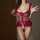 Woman wearing red lace bodysuit with sheer panels and open-crotch design, enhancing bust and elegance.