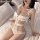 Sensual lace bodysuit featuring sheer cut-out design, delicate bows, and open-crotch style for womens sheer mesh lingerie.