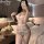 Sensual lace bodysuit for women featuring sheer cut-out design, pure white mesh fabric, bow-tie straps, and open-crotch style...