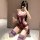 Woman in purple sensual lace bodysuit by qqny, kneeling with wine glass, elegant and alluring design.