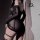 Sensual lace bondage lingerie set featuring sheer black mesh and stockings, perfect for women seeking allure and sophisticati...
