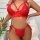 Woman wearing red lace lingerie set with sheer thong and strappy bra, part of the sensual lace bondage-style plus size erotic...