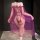 Woman wearing sensual lace lingerie set with sheer mesh robe and high-end stockings, showcasing playful elegance from behind.