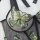 Sensual lace sheer lingerie set featuring intricate green butterfly embroidery on transparent fabric with black trim details.