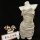 Sensual lace sleep dress with drawstring waist, displayed on mannequin. slim-fit lingerie set in soft satin finish.