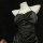 Black satin sleep dress with lace trim and drawstring waist on mannequin.