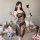 Woman wearing black lace sleep dress with sheer mesh, high slit & backless design; sensual nightgown for women.