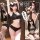 Model showcases black crop top & high-waisted shorts set with white trim, styled sporty-chic for bold, sensual contrast.