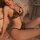Woman wearing sensual leopard print lace thong set with adjustable cut-outs, perfect for flirty bedroom play.