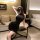 Woman in black ribbed halter dress posing in hotel room, showcasing sensual lingerie for women – pure & playful erotic outfit...