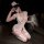 Woman kneeling in white sensual nurse costume with lace trim, high slit, and bow details – minimalist role play lingerie set.