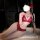 Woman modeling red lace babydoll nightgown with butterfly tie straps and push-up bra, sheer design, elegant lingerie set.