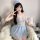 A woman poses playfully wearing a light blue sensual sheer lace slip dress, perfect for nightwear. the delicate design featur...