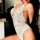 Wholesale sexy backless lace bodysuit featuring intricate floral lace design, seductive snap-front, and tight fit for erotic ...