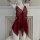 Red sheer mesh sleep dress with butterfly neck strap and backless lace design on a mannequin.
