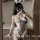 Woman in white sheer mesh bunny costume with open-crotch, cut-out top, lace trim, gloves, and ears — perfect for adults’ nigh...