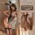 Woman modeling sexy bunny girl bodysuit with cut-outs, sheer mesh, lace trim, and fishnet stockings.