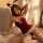Sexy bunny girl costume set featuring a red velvet wrap top with bow, sheer lace garter belt, and bunny ears for a seductive ...