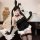 Woman wearing sexy bunny lingerie set with sheer dress, adjustable straps, and lace stockings. cute alluring design for women...