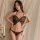 Woman modeling black butterfly bodysuit lingerie with adjustable straps and open-crotch design, styled as seductive sleepwear...