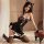 Woman wearing black lace catwoman lingerie sleep dress with off-shoulder sheer design, maid-style trim, and matching ears.