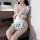 Woman wearing sexy cowgirl maid costume with playful polka dot lingerie set, featuring cute ruffles and tempting no-remove de...