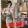 Woman modeling a shiny silver deep v backless bodycon bandage dress, perfect for hot nightclub and lingerie outfits.