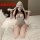 Woman modeling a sexy deep v lace bunny costume with open-crotch design, featuring a seductive backless role play outfit.