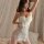 Woman wearing white deep v lace sleep dress with sheer mesh cami and skirt, flirty wrinkled bodice for small bust.