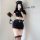 Woman in black police-style cosplay lingerie set with cap, gloves, and handcuffs – sexy role play outfit for women.