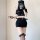 Woman wearing sexy police-style lingerie set with cap, gloves, and gartered stockings for cosplay or role play.