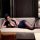 Woman lounging on sofa in deep v-neck bodycon skirt set, styled as a sexy flight attendant or seductive secretary costume for...