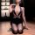 Woman kneeling in sexy flight attendant outfit with deep v-neck bodycon skirt set, seductive secretary costume for adults.