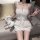 Woman wearing white sheer lingerie sleepwear set with lace trim, holding teddy bear on couch — sexy palace-inspired two-pie...
