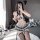 Woman posing in mirror wearing sexy jk uniform set with plaid pleated mini skirt, matching top, tie, and thigh-high stockings...