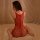 Woman wearing red lace bodysuit with garter straps and open-crotch design, sheer mesh sleepwear for intimate moments.