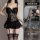 Sexy black lace bodysuit with sheer mesh, ruffled hem, and matching thigh-high stockings for date night lingerie.