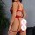 Woman wearing red lace bodysuit sleepwear with sheer mesh camisole, push-up and slimming design, shown from back.