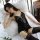 Elegant black lace bodysuit with corset-style design, paired with matching stockings, perfect for women seeking stylish and s...