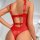 Woman wearing red sheer mesh bodysuit with tie-straps and cutout back, sexy lace lingerie set in style.