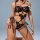 Woman wearing black lace bodysuit with sheer mesh and crisscross straps, featuring a no-remove design for erotic lingerie app...