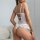 Sexy lace bodysuit featuring sheer backless design with delicate lace trimmings, perfect for women seeking stylish and elegan...